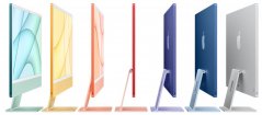 Boční pohled na sedm různě barevných iMaců